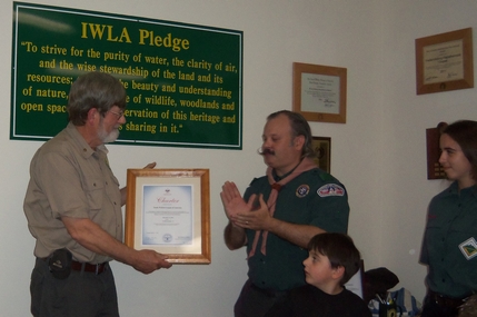 Neil Dishmand presents a certificate of Appreciation to President Raines